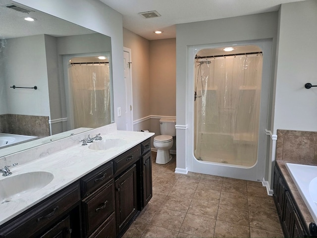 full bathroom featuring vanity, plus walk in shower, tile patterned floors, toilet, and a textured ceiling