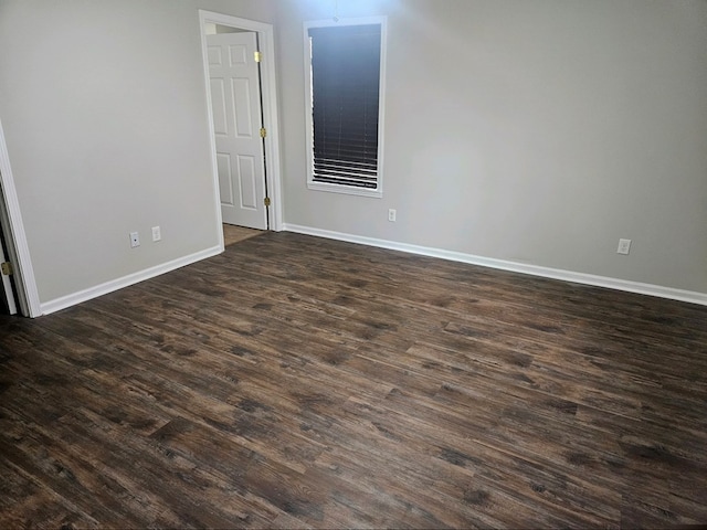 spare room featuring dark hardwood / wood-style floors