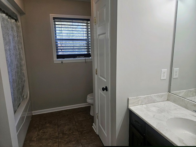 full bathroom featuring tile patterned flooring, vanity, toilet, and shower / bath combo with shower curtain