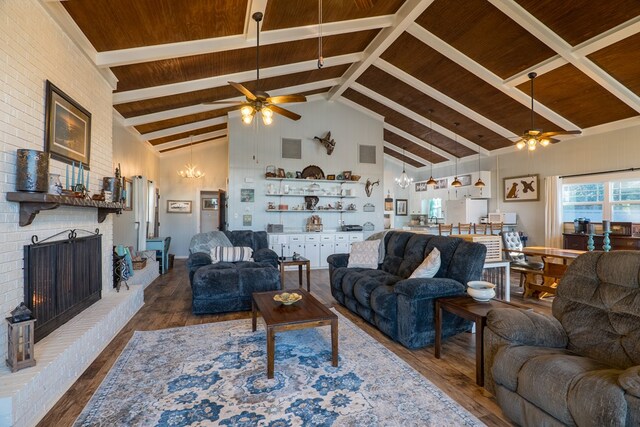 dining room with wood-type flooring, a brick fireplace, high vaulted ceiling, and wooden ceiling