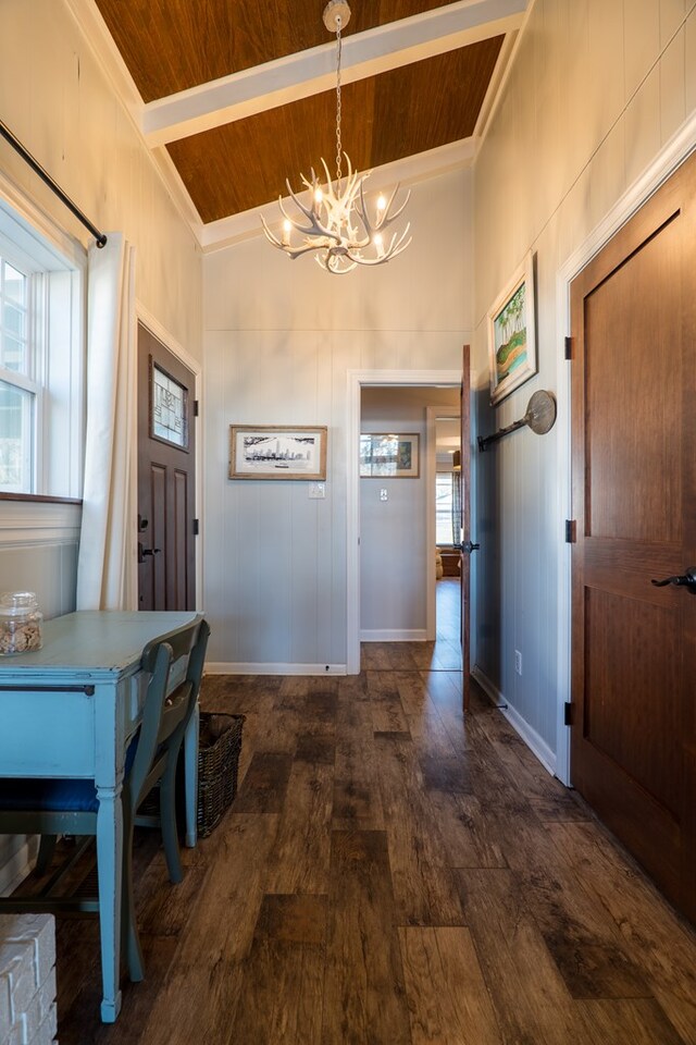 living room with dark hardwood / wood-style flooring, wooden ceiling, a fireplace, and high vaulted ceiling