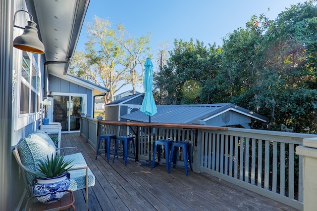 wooden terrace with a bar