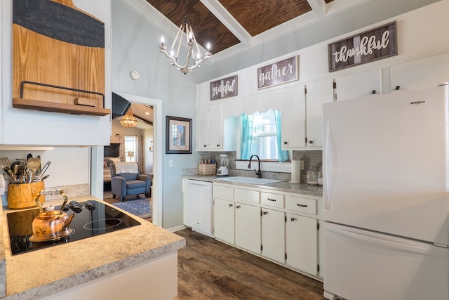 kitchen with white appliances, sink, beam ceiling, pendant lighting, and white cabinetry