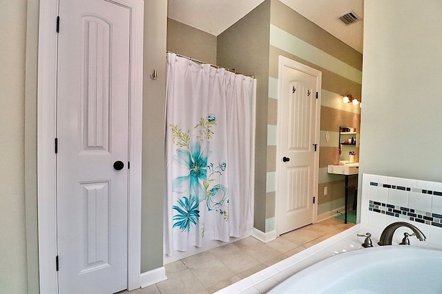 3342 Norton Pl, Valdosta, GA 31605 - full bath with a bathtub, curtained shower, and tile patterned flooring