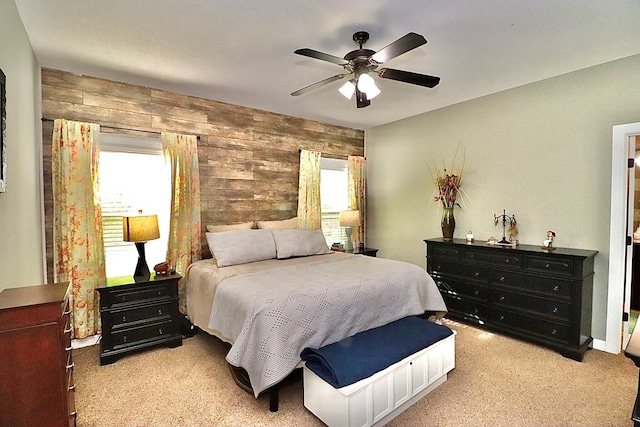 3342 Norton Pl, Valdosta, GA 31605 - bedroom with multiple windows, wood walls, light carpet, and a ceiling fan