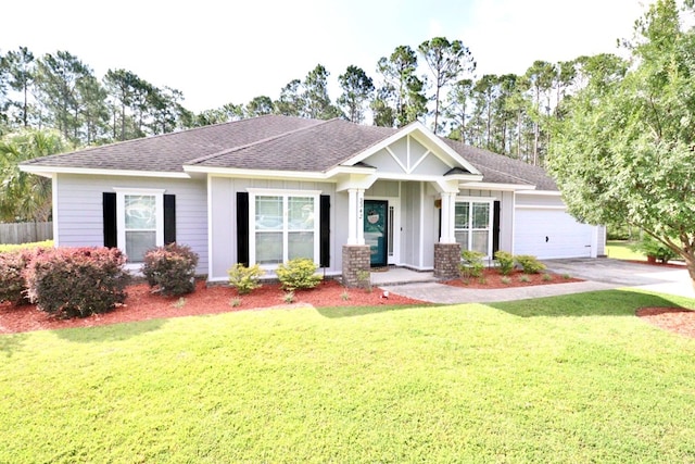 3342 Norton Pl, Valdosta, GA 31605 - craftsman inspired home with a garage, a shingled roof, a front lawn, and concrete driveway
