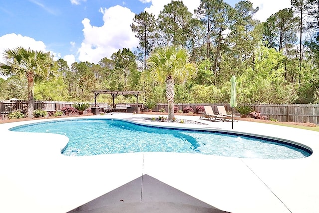 3342 Norton Pl, Valdosta, GA 31605 - view of pool featuring a pergola, a fenced backyard, a patio area, and view of wooded area