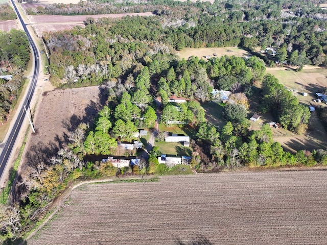 birds eye view of property with a rural view