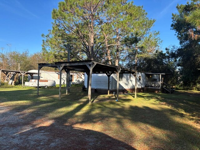 56 Egypt Rd Unit 10, Thomasville, GA 31757 - view of grassy yard with a wooden deck