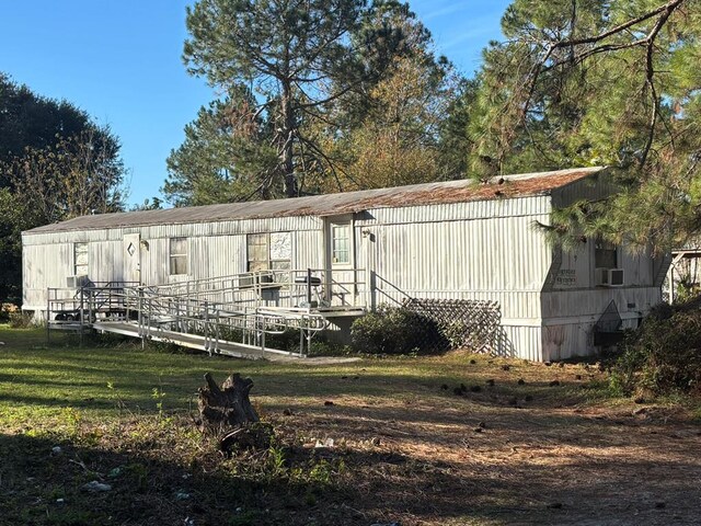 56 Egypt Rd Unit 10, Thomasville, GA 31757 - back of property featuring a yard