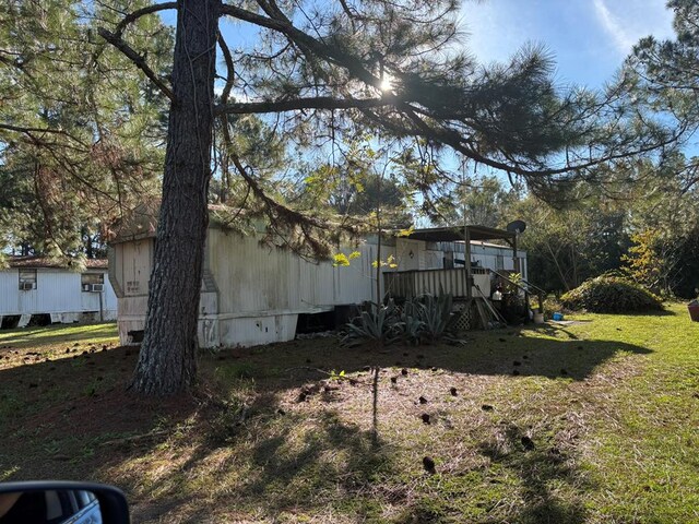 56 Egypt Rd Unit 10, Thomasville, GA 31757 - view of grassy yard featuring a deck