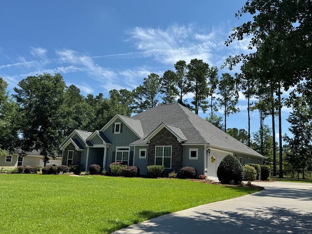 5029 Falling Spgs, Valdosta, GA 31602 - craftsman inspired home featuring board and batten siding, a front lawn, concrete driveway, and roof with shingles