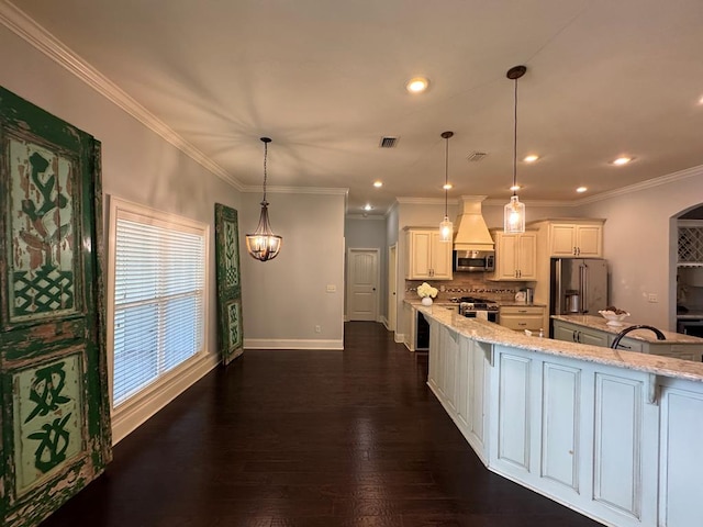 5029 Falling Spgs, Valdosta, GA 31602 - kitchen featuring stainless steel appliances, a kitchen bar, light stone countertops, decorative backsplash, and a large island