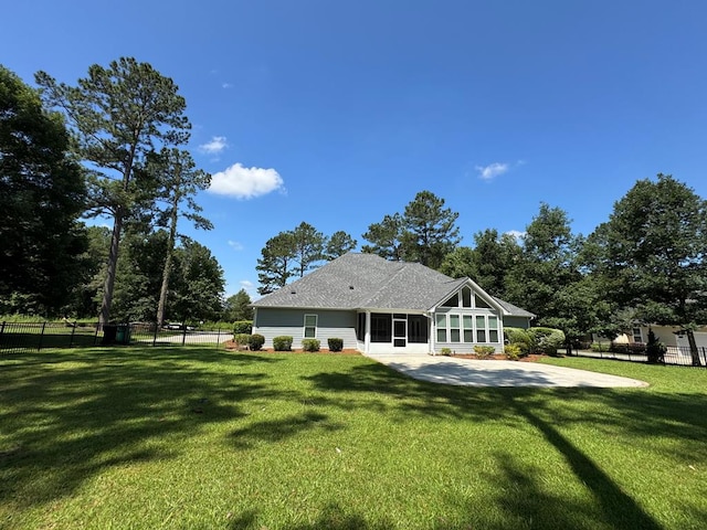 5029 Falling Spgs, Valdosta, GA 31602 - rear view of house featuring a sunroom and a patio area