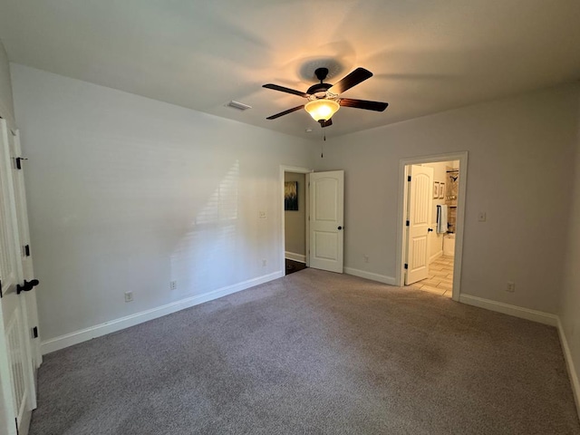 5029 Falling Spgs, Valdosta, GA 31602 - unfurnished bedroom featuring carpet flooring, connected bathroom, and ceiling fan