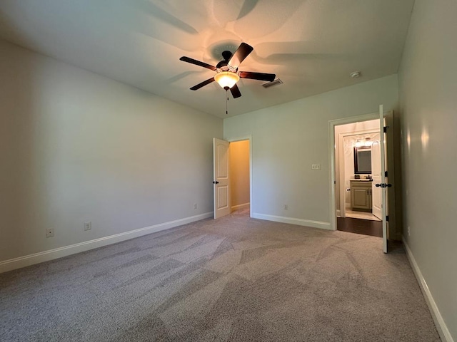 5029 Falling Spgs, Valdosta, GA 31602 - unfurnished bedroom with carpet floors, connected bathroom, and ceiling fan