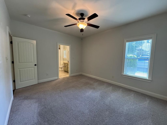 5029 Falling Spgs, Valdosta, GA 31602 - unfurnished bedroom featuring light carpet, ensuite bathroom, and a ceiling fan