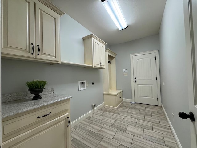 5029 Falling Spgs, Valdosta, GA 31602 - laundry room featuring hookup for an electric dryer, cabinet space, and washer hookup