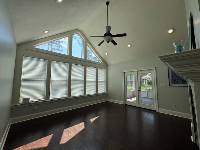 5029 Falling Spgs, Valdosta, GA 31602 - unfurnished living room featuring dark wood finished floors, vaulted ceiling, a ceiling fan, recessed lighting, and french doors