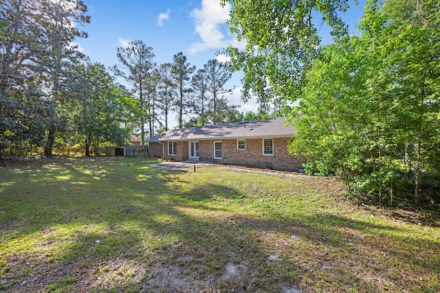 4848 Lori St, Valdosta, GA 31605 - back of house with a patio and brick siding