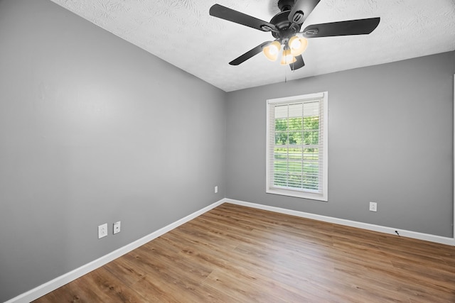 4848 Lori St, Valdosta, GA 31605 - spare room featuring a ceiling fan, baseboards, wood finished floors, and a textured ceiling