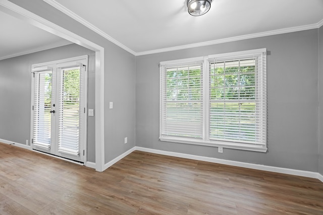 4848 Lori St, Valdosta, GA 31605 - empty room featuring baseboards, wood finished floors, ornamental molding, and french doors
