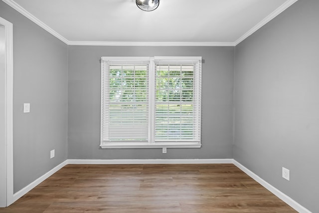 4848 Lori St, Valdosta, GA 31605 - spare room featuring crown molding, baseboards, and wood finished floors