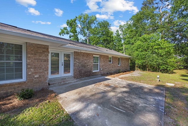 4848 Lori St, Valdosta, GA 31605 - view of home's exterior with a patio area, brick siding, and french doors