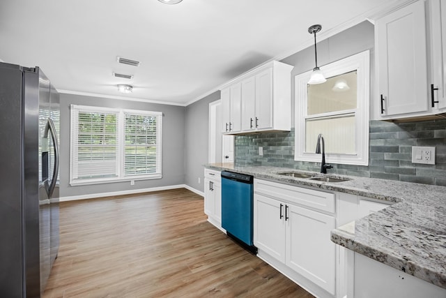 4848 Lori St, Valdosta, GA 31605 - kitchen with stainless steel fridge with ice dispenser, dishwashing machine, a sink, ornamental molding, and white cabinets