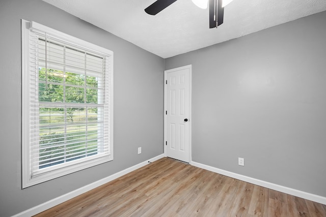 4848 Lori St, Valdosta, GA 31605 - spare room featuring baseboards, wood finished floors, healthy amount of natural light, and a ceiling fan