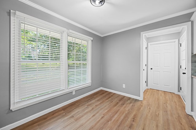 4848 Lori St, Valdosta, GA 31605 - empty room with light wood finished floors, baseboards, and crown molding