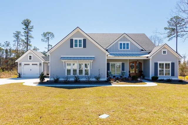 view of front of home with metal roof, a shingled roof, board and batten siding, a front lawn, and a standing seam roof