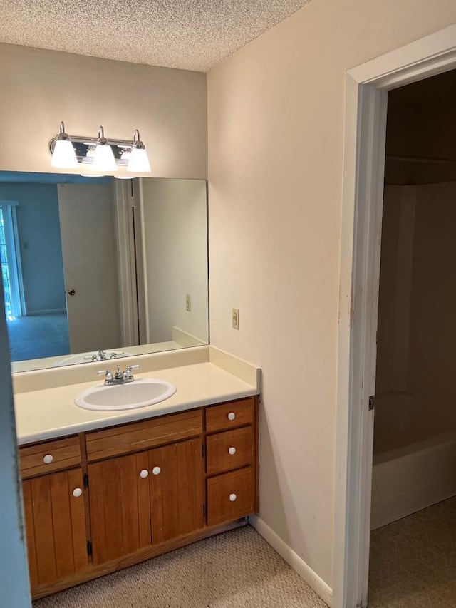 bathroom featuring vanity and a textured ceiling