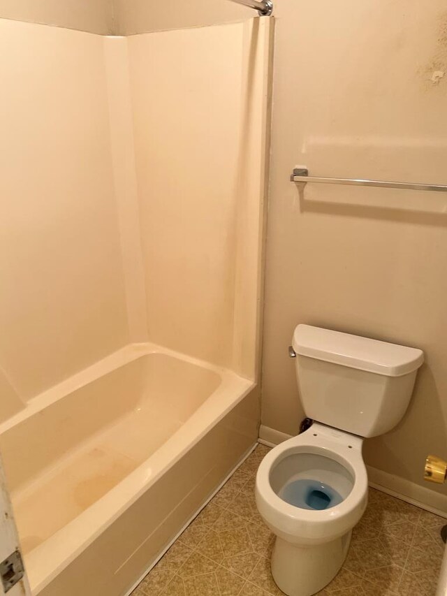 bathroom featuring tile patterned flooring and toilet