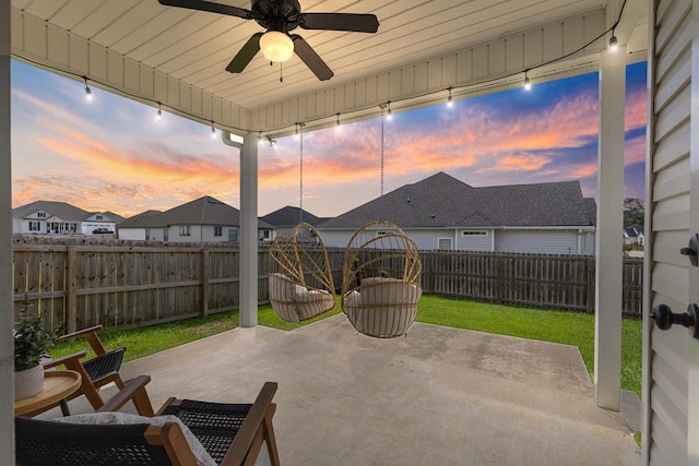 view of patio / terrace featuring a residential view, a ceiling fan, and a fenced backyard