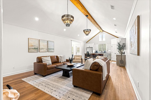 living area featuring light wood finished floors, lofted ceiling with beams, a notable chandelier, visible vents, and baseboards