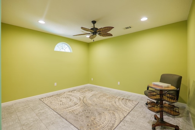 interior space with ceiling fan