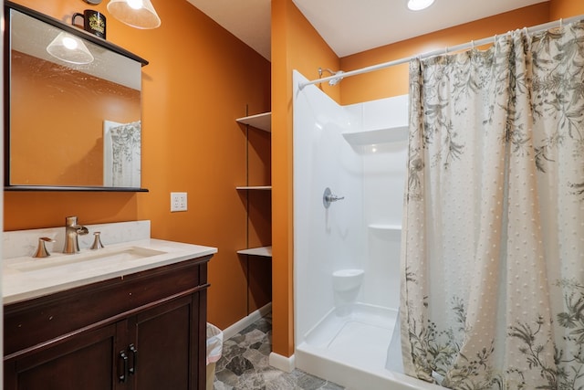 bathroom featuring a shower with curtain and vanity