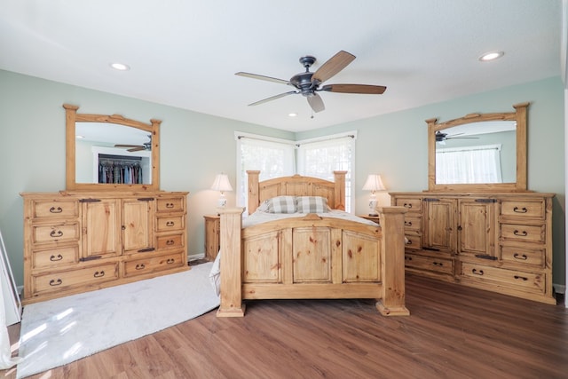 unfurnished bedroom featuring ceiling fan and dark wood-type flooring