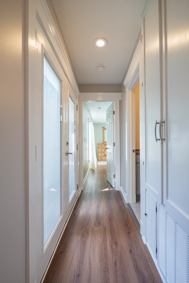 hall with dark hardwood / wood-style flooring and french doors