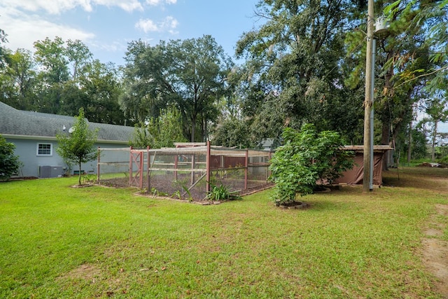 view of yard with central AC unit