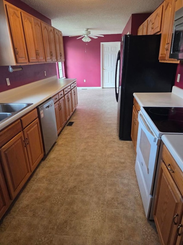717 E 44th St, Tifton, GA 37194 - kitchen featuring white range with electric stovetop, stainless steel dishwasher, a ceiling fan, a textured ceiling, and light countertops