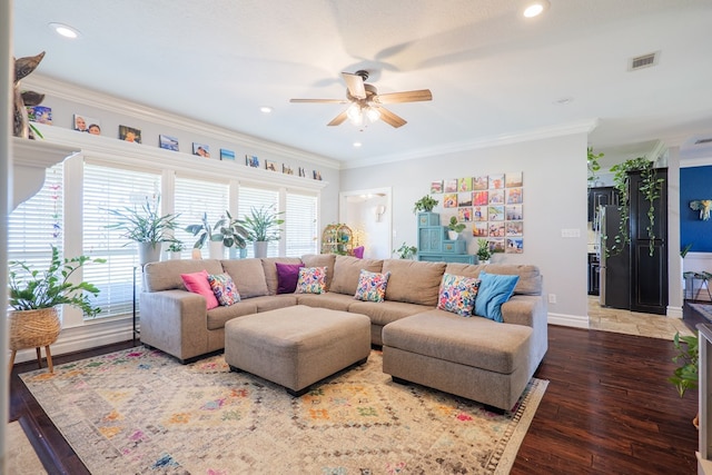 living room with recessed lighting, visible vents, wood-type flooring, and ornamental molding