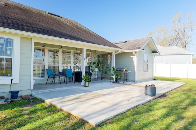 view of patio with grilling area and fence