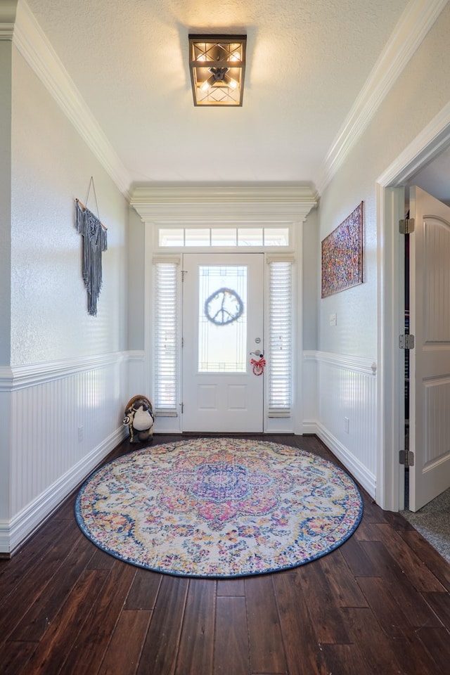 foyer featuring wainscoting, crown molding, and wood-type flooring