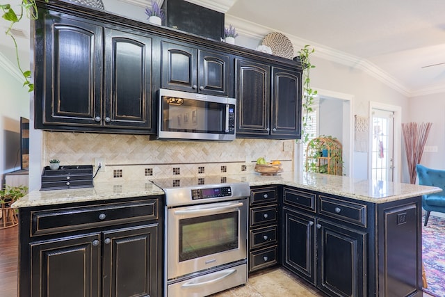 kitchen featuring crown molding, decorative backsplash, a peninsula, stainless steel appliances, and dark cabinets