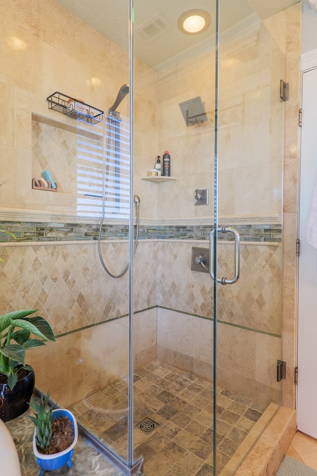 bathroom featuring a stall shower