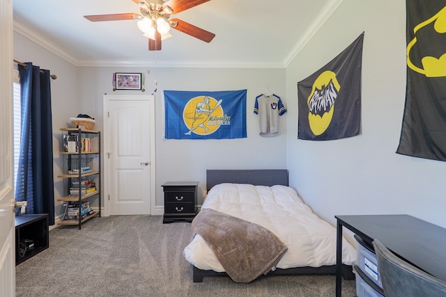 bedroom with ceiling fan, carpet floors, and ornamental molding