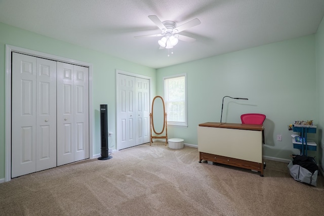 4600 Rustic Ridge Rd, Valdosta, GA 31602 - bedroom featuring carpet flooring, multiple closets, and a ceiling fan