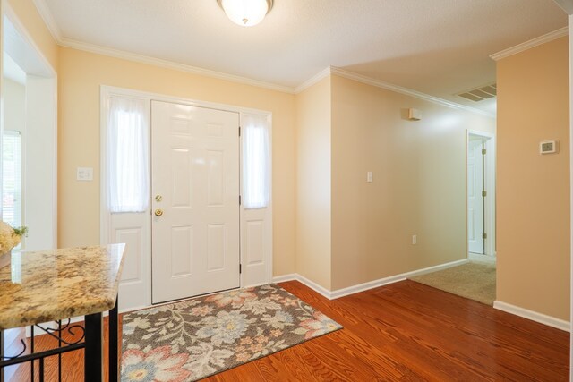 4600 Rustic Ridge Rd, Valdosta, GA 31602 - entrance foyer featuring ornamental molding, wood finished floors, and healthy amount of natural light